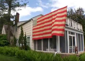 Orono man hangs Civil War-era flag for display outside his home for the first time
