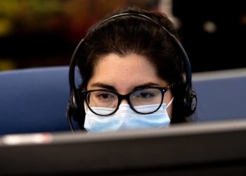 How can I talk to a real person when phoning the IRS helpline?