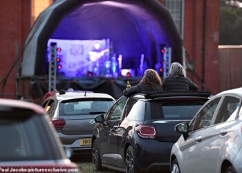 UK’s first drive-in music concert sees three bands perform to sell-out crowd of 80 cars