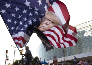 President threatens protesters, mayor imposes curfew