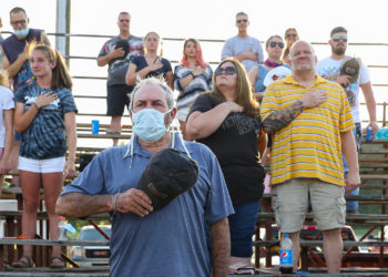 Why do so many Americans refuse to wear face masks? Politics is part of it — but only part