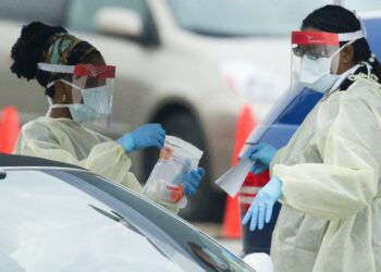 UK eases restrictions as US hits record on daily cases