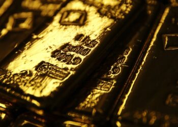 Gold pierces $1,800 as virus surge dents swift recovery hopes | USA News