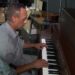 Hitting a high note; Tampa middle school custodian makes music for teachers, students