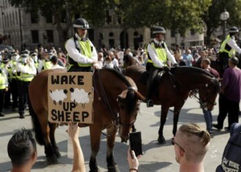 Virus measures targeted by protesters despite case spikes | World News