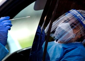 States set case records; NYC protest leader arrested