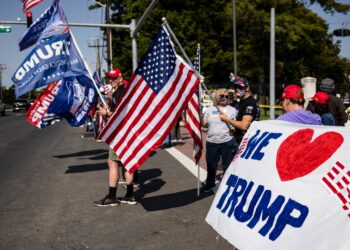 Critics react to Trump’s ‘joy ride’ to see supporters