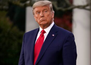 Trump is out of view but working, firing officials, including Krebs