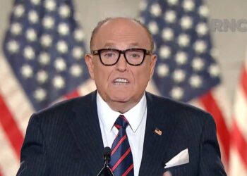 Conspiracies, cigars, and ink-stained palms: Giuliani’s bizarre video