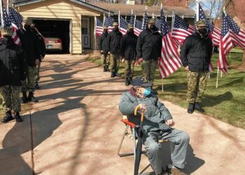Cary World War II veteran honored for 100th birthday with 100 American flags