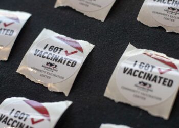 CDC updates travel guidance; Michigan case spike